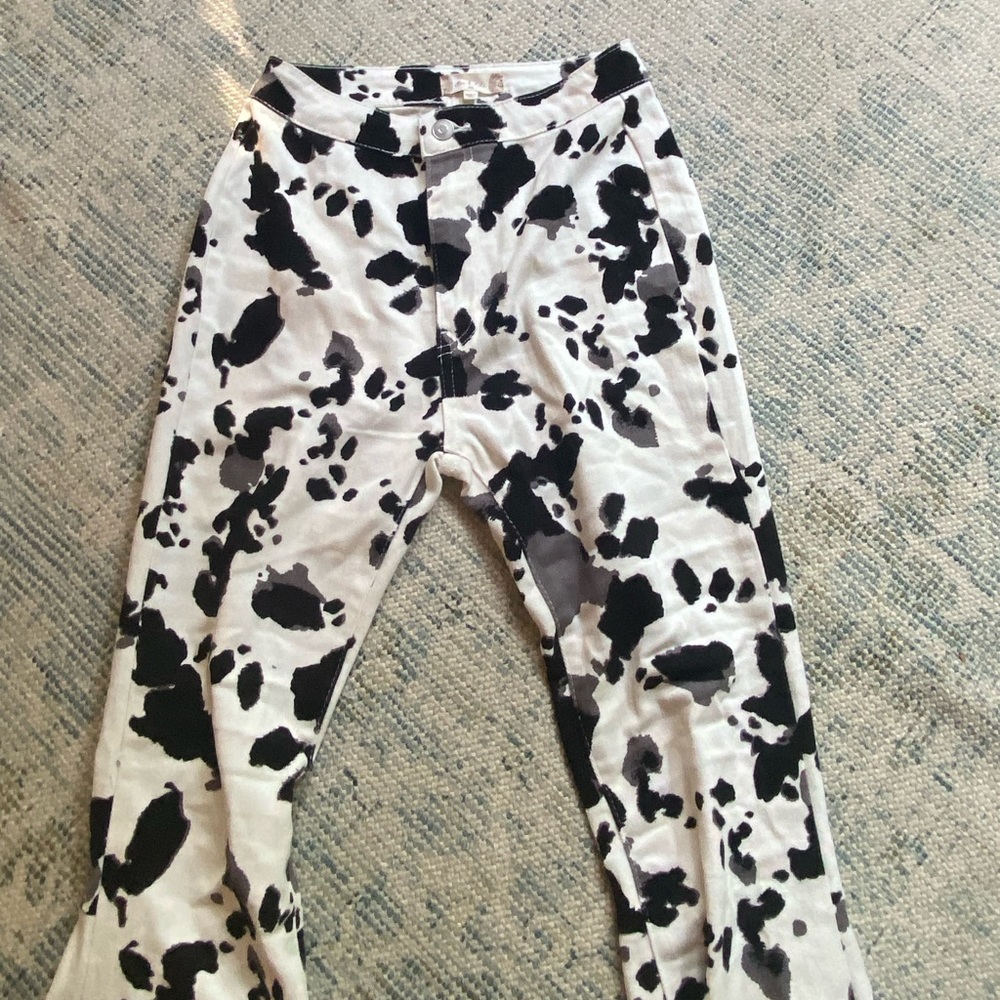 Altered state cow print flare jeans. Never worn. Size x small